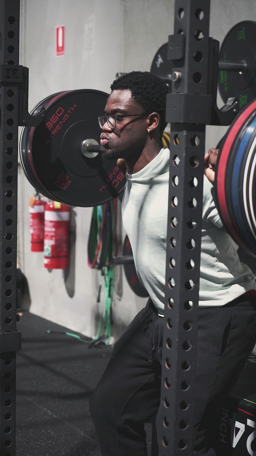 Athlete setting up for a heavy squat in the From Zero gym